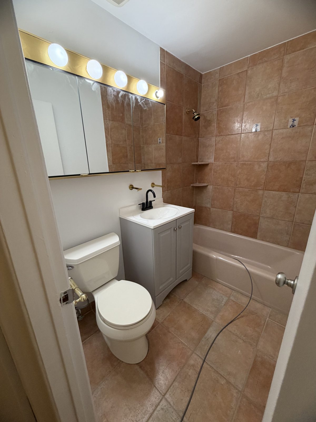 Repainted Scarsdale NY bathroom with new vanity and faucet
