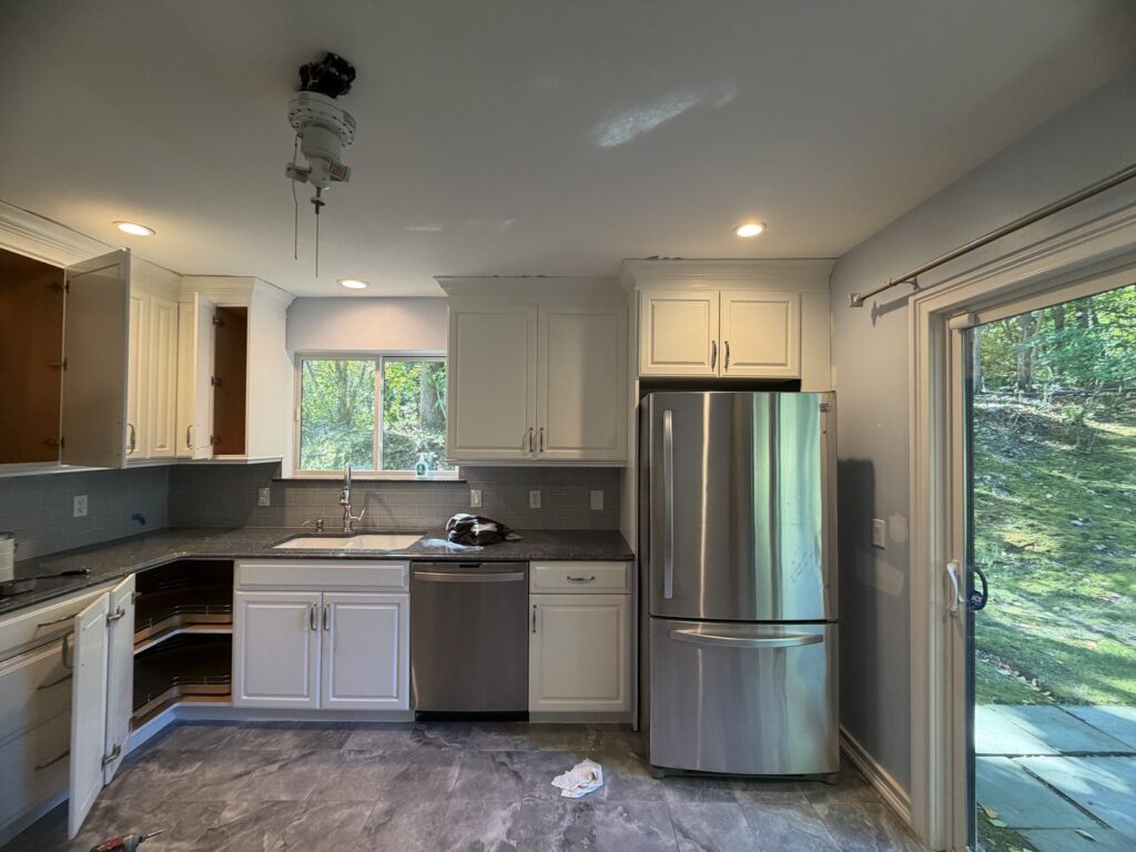 Kitchen cabinets repainted white with Sherwin-Williams Gallery Series in Somers NY by GCMM Home Improvement