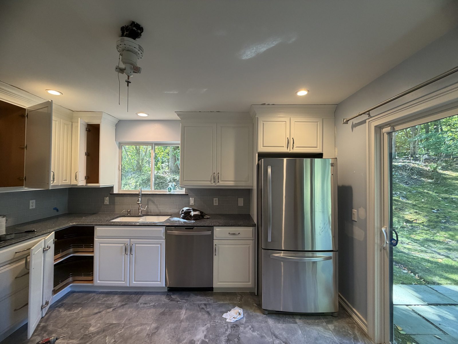 Repainted kitchen cabinets with stainless appliances in Somers NY